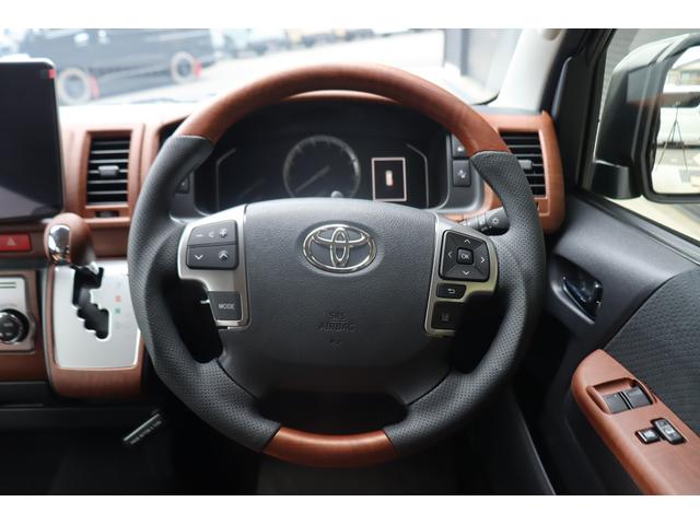 ハイエースバン ロングスーパーGL アースカラーパッケージ ベージュ ガソリン2WD 角目フェイス クラシックテール カリフォルニア16インチAW ナスカータイヤ アルパインナビ 茶木目インパネ ベッドキット シートカバー ETCPVM(49枚目)