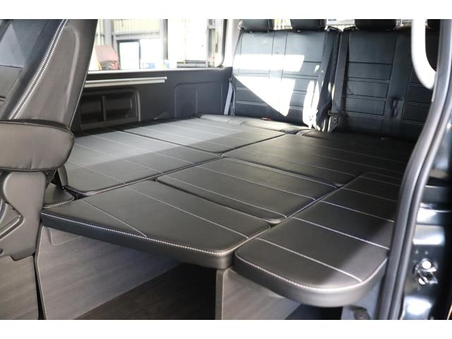 ハイエースワゴン ＧＬ　ロング　内装架装Ｖｅｒ１　フローリング施工　ベットキット　専用テーブル　ＢＩＧＸ１１インチナビ　１０インチフリップダウンモニター　パノラミックビューモニター　デジタルインナーミラー　パワースライドドア（30枚目）