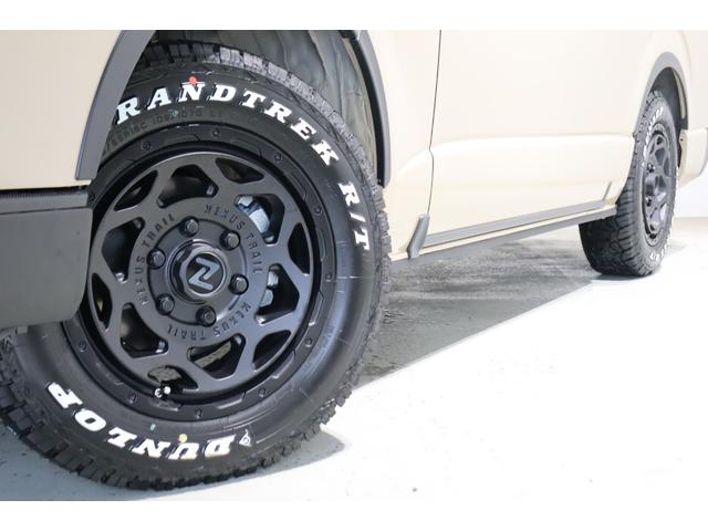 ハイエースバン ロングスーパーGL アースカラーパッケージ ブラックエディション仕様/オフロードパッケージ BIG-X11インチナビ 高さ調整式ベットキット フロントエアロ オーバーフェンダー LEDテール NT-1アルミ ダンロップ(34枚目)