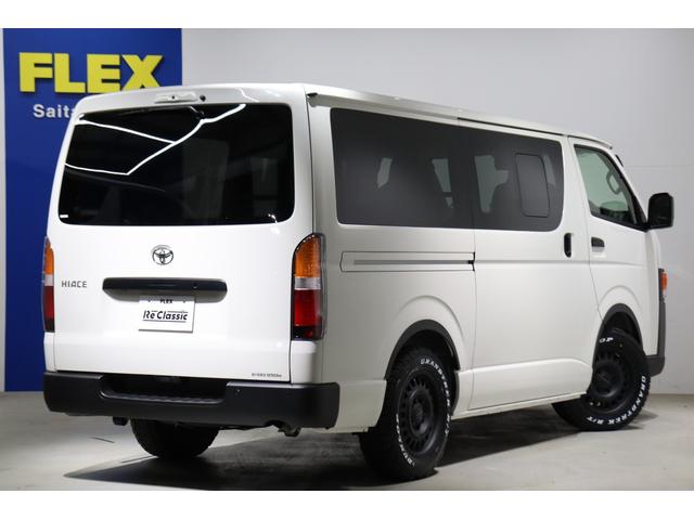 ハイエースバン ロングＤＸ　新車　ＤＸ　ガソリン２ＷＤ　丸目　Ｒｅグリル　Ｔ－ＦＯＲＣＥ　ＮＣ－１／１６インチＡＷ　ダンロップ　オーバーフェンダー　クラシックテール　アルパインナビ　ＨＤＭＩ　ベッド　シートカバー　デジタルミラー（56枚目）