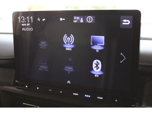 ステップワゴン ｅ：ＨＥＶスパーダ　純正ナビ　リヤ席モニター　マルチビュー　フルセグ　両側電動スライドドア　ＥＴＣ　シートヒーター　ブラインドスポットモニター　パワーテールゲート　Ｂｌｕｅｔｏｏｔｈ　スマートキー　１オーナー　ＥＳＣ（7枚目）