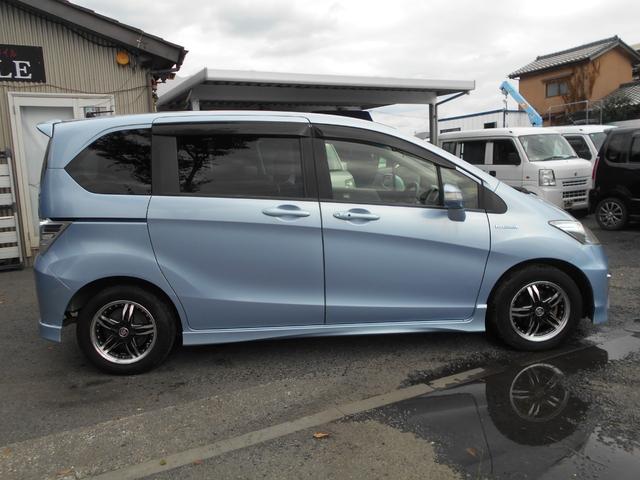 フリードハイブリッド ジャストセレクション 新品ワンセグ付ナビ 新品ドラレコ パワースライドドア スマートキー ETC ウィンカーミラー 社外15インチアルミ 純正HID リアスポイラー チェーンベルト(10枚目)