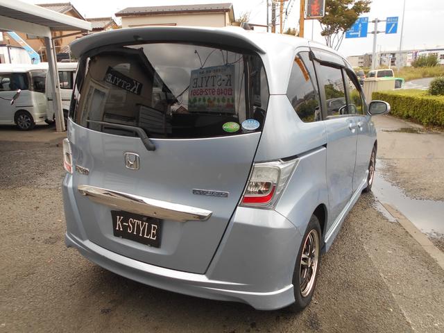 フリードハイブリッド ジャストセレクション 新品ワンセグ付ナビ 新品ドラレコ パワースライドドア スマートキー ETC ウィンカーミラー 社外15インチアルミ 純正HID リアスポイラー チェーンベルト(24枚目)