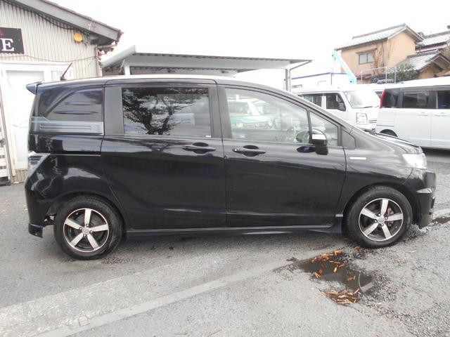 フリードスパイクハイブリッド ジャストセレクション 純正9インチナビ フルセグTV バックカメラ 新品ドラレコ 両側パワースライドドア スマートキー ETC 社外15インチアルミ ウィンカーミラー リアスポイラー 純正HID チェーンベルト(8枚目)