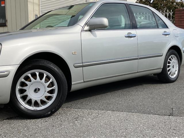 プログレ ＮＣ２５０　ウォールナットパッケージ　前期型　直６／１ＪＺ－ＧＥエンジン　本木パネル　ウッドコンビハンドル　キーレス　純正ＤＶＤナビ　ハーフシートカバー　純正アナログクロック　パワーシート　左右独立Ａ／Ｃ　電動ステアチルト　純正１５アルミ（9枚目）