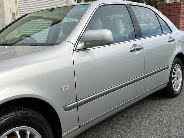 プログレ ＮＣ２５０　ウォールナットパッケージ　前期型　直６／１ＪＺ－ＧＥエンジン　本木パネル　ウッドコンビハンドル　キーレス　純正ＤＶＤナビ　ハーフシートカバー　純正アナログクロック　パワーシート　左右独立Ａ／Ｃ　電動ステアチルト　純正１５アルミ（27枚目）