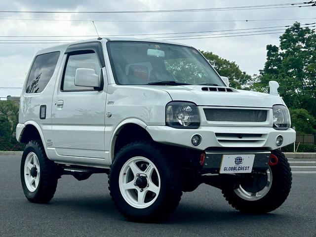 ＸＧ　最終１０型　走行距離４２５６ＫＭ　足廻リフトアップ　ＡＵＴＯＣＲＯＳＳ前後バンパー　ＴＡＮＩＧＵＣＨＩサイドステップ　４×４．１６ｉｎｃｈＡＷ　ＡｕｔｏＧａｕｇｅ３連メーター　ストラーダ７型メモリナビ(11枚目)