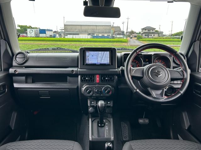 ジムニー ＸＧ　１年保証付　修復歴無　禁煙　運転支援　新車保証書・記録簿　足廻リフトアップ　ＯＲＩＧＩＮ前後バンパー・フロントグリル・オーバーフェンダ　ＯＲＩＧＩＮ１６ＡＷ　ｃａｒｒｏｚｅｒｉａ７型ナビ・ＴＶ　ＥＴＣ（13枚目）