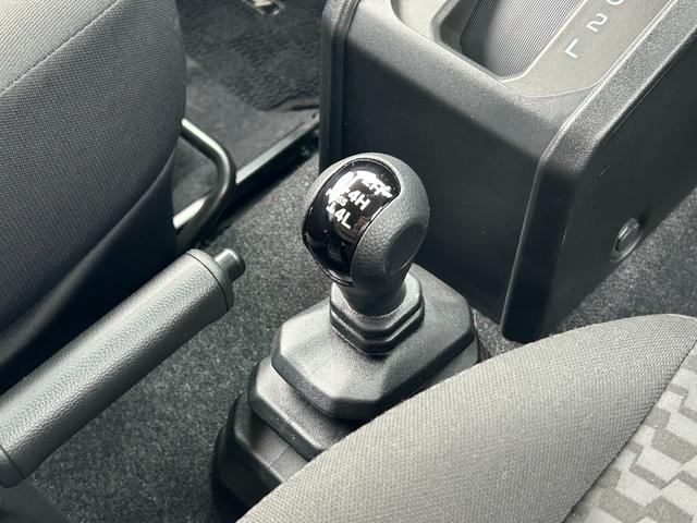 ジムニー ＸＧ　１年保証付　修復歴無　禁煙　運転支援　新車保証書・記録簿　足廻リフトアップ　ＯＲＩＧＩＮ前後バンパー・フロントグリル・オーバーフェンダ　ＯＲＩＧＩＮ１６ＡＷ　ｃａｒｒｏｚｅｒｉａ７型ナビ・ＴＶ　ＥＴＣ（24枚目）