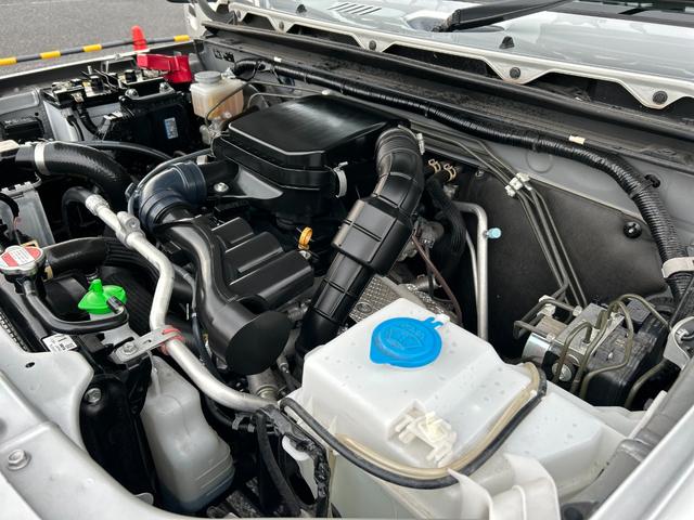 ジムニー ＸＧ　１年保証付　修復歴無　禁煙　運転支援　新車保証書・記録簿　足廻リフトアップ　ＯＲＩＧＩＮ前後バンパー・フロントグリル・オーバーフェンダ　ＯＲＩＧＩＮ１６ＡＷ　ｃａｒｒｏｚｅｒｉａ７型ナビ・ＴＶ　ＥＴＣ（53枚目）