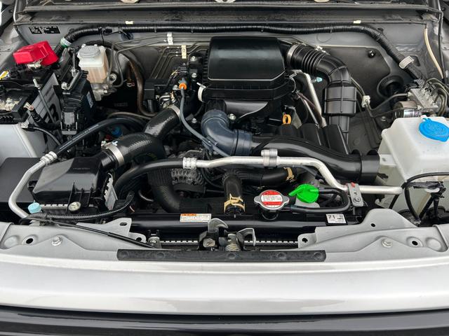 ジムニー ＸＧ　１年保証付　修復歴無　禁煙　運転支援　新車保証書・記録簿　足廻リフトアップ　ＯＲＩＧＩＮ前後バンパー・フロントグリル・オーバーフェンダ　ＯＲＩＧＩＮ１６ＡＷ　ｃａｒｒｏｚｅｒｉａ７型ナビ・ＴＶ　ＥＴＣ（54枚目）