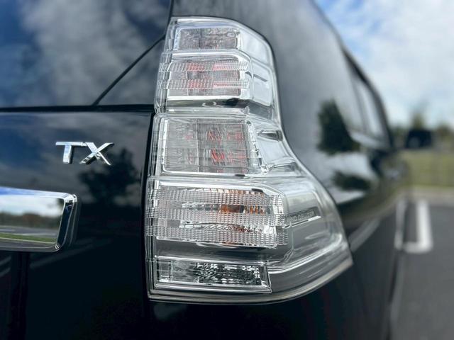 ランドクルーザープラド ＴＸ　Ｌパッケージ　修復無　モデリスタ前後ハーフエアロ・マフラー　サンルーフ　ＣＲＩＭＳＯＮ２０ＡＷ　純正サイドステップ・リアスポイラー　ルーフレール　黒革暖房パワーシート　電動３列シート　木目調パネル　コーナーセンサー（55枚目）