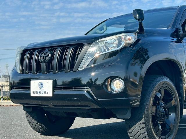 ランドクルーザープラド TX 新車保証書・記録簿 修復無 ONESAS2インチリフトアップ KMC20inchAW サイドステップ ルーフレール リアスポイラー マルチテレインセレクト 黒レザーシートカバー ETC スマートキー(34枚目)