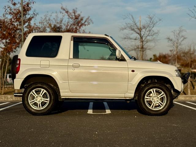 キックス RX 全国対応1年保証付 4速A/T・ターボ 4WD リフトアップ 社外15AW 社外ラテラルロッド パイプガード LED作業灯 フォグランプ ドアバイザー ディスプレイオーディオ キーレス 電動格納ミラー(9枚目)