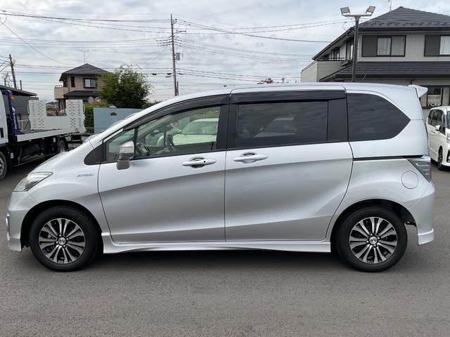 フリードハイブリッド ジャストセレクション ナビ ETC 両側電動スライドドア バックカメラ HIDヘッドライト フォグライト スマートキー 衝突安全ボディ クルコン オートエアコン エアバック キャプテンシート 純正アルミ ABS(3枚目)