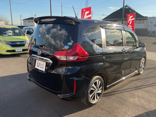 フリード Ｇ・ホンダセンシング　ナビ　ＥＴＣ　バックカメラ　両側電動スライドドア　サイド＆カーテンエアバック　追突被害軽減ブレーキ　車線逸脱警報システム　追突安全ボディ　リア席モニター　スマートキー　　クルコン　ＬＥＤヘッドライト（6枚目）