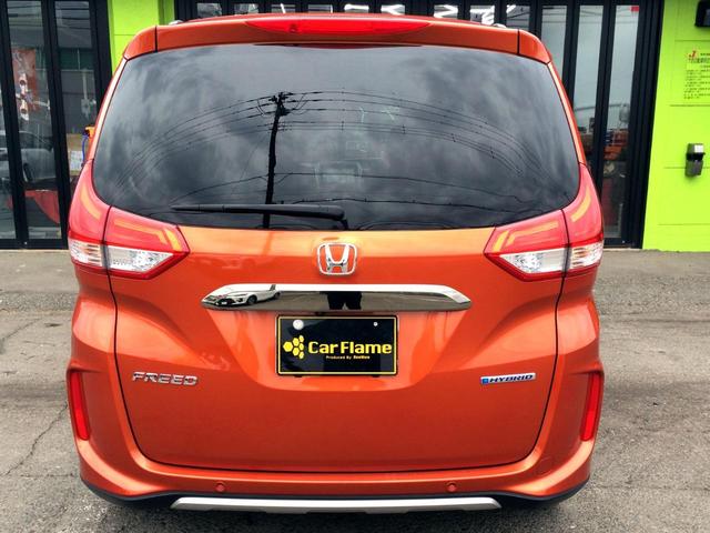 フリードハイブリッド ハイブリッド・クロスターホンダセンシング /クロスター専用装備/純正9インチナビ/フリップダウンモニター/バックカメラ/ハーフレザーシート/シートヒーター/両電動ドア/ホンダセンシング/純正ドラレコ/1オナ/記録簿/禁煙車/全国1年保証(13枚目)