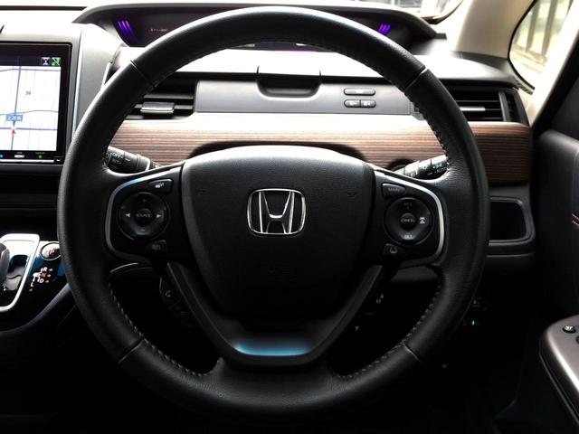 フリードハイブリッド ハイブリッド・クロスターホンダセンシング /クロスター専用装備/純正9インチナビ/フリップダウンモニター/バックカメラ/ハーフレザーシート/シートヒーター/両電動ドア/ホンダセンシング/純正ドラレコ/1オナ/記録簿/禁煙車/全国1年保証(17枚目)