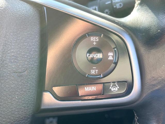 シビック ハッチバック　ホンダセンシング　６速ＭＴ　純正ナビ　ＥＴＣ　ドライブレコーダー　ＬＥＤヘッドライト　純正１８インチアルミホイール　シートヒーター　スマートキー　アイドリングストップ　オートライト　オートエアコン　革巻きステアリング（23枚目）