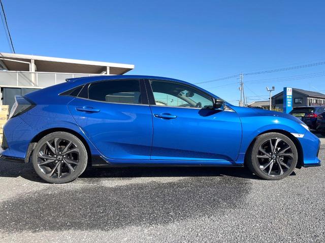 シビック ハッチバック　ホンダセンシング　６速ＭＴ　純正ナビ　ＥＴＣ　ドライブレコーダー　ＬＥＤヘッドライト　純正１８インチアルミホイール　シートヒーター　スマートキー　アイドリングストップ　オートライト　オートエアコン　革巻きステアリング（51枚目）