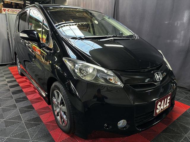 フリード Ｇ　ジャストセレクション　１年間走行距離無制限保証　両側電動パワースライドドア　モデューロエアロ　ナビ　ＤＶＤ　フルセグＴＶ　Ｂｌｕｅｔｏｏｔｈ　前後ドラレコ　バックカメラ　新品フロアマット　消耗品交換　予防整備実施車（7枚目）