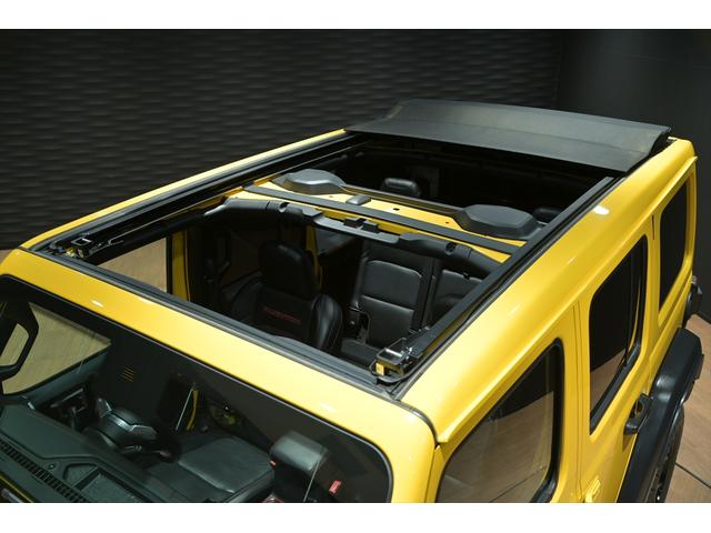 ジープ・ラングラーアンリミテッド ルビコン スカイワンタッチパワートップ 49台限定車/ヘラヤライエロー/純正電動ソフトトップ/ボンネットシールド/専用19インチAW/専用ロゴステッカー/専用デフロック機構/シートヒーター/ステアリングヒーター/BFグドリッヂMTタイヤ(2枚目)