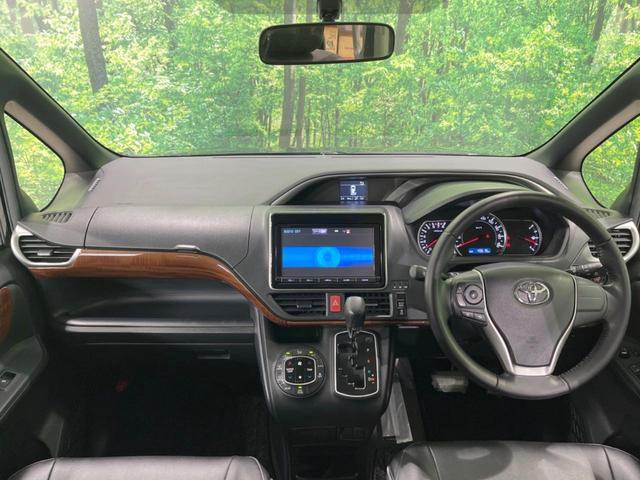 ヴォクシー ＺＳ　煌　禁煙車　純正９型ナビ　後席モニター　両側電動スライドドア　バックカメラ　Ｂｌｕｅｔｏｏｔｈ　ＥＴＣ　フルセグＴＶ　ＬＥＤヘッドランプ　スマートキー　オートライト　アイドリングストップ　ＤＶＤ再生（2枚目）