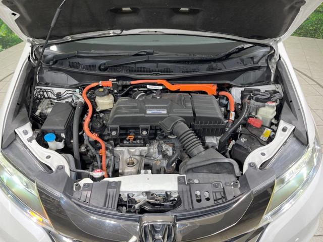 オデッセイハイブリッド ハイブリッドアブソルート・ホンダセンシング 禁煙車 純正9型ナビ フリップダウンモニター 両側電動ドア 衝突軽減装置 レーダークルーズ リアオートエアコン シートヒーター パワーシート 車線逸脱警報 ドラレコ スマートキー ETC(19枚目)