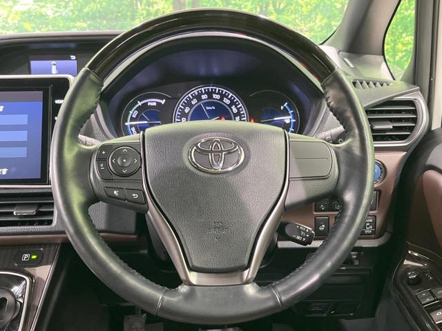 エスクァイア ハイブリッドGi プレミアムパッケージ 禁煙車 純正10型ナビ フリップダウンモニター 両側電動ドア 衝突軽減装置 シートヒーター クルコン リアオートエアコン 車線逸脱警報 バックカメラ スマートキー ETC2.0(52枚目)