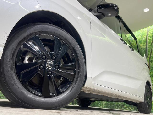 フリード+ハイブリッド ハイブリッドGブラックスタイル 両側電動スライド 純正8型ナビ バックカメラ 衝突被害軽減装置 レーダークルーズ 禁煙車 ドラレコ シートヒーター レーンアシスト LEDヘッド ETC 純正15インチアルミホイール オートライト(15枚目)