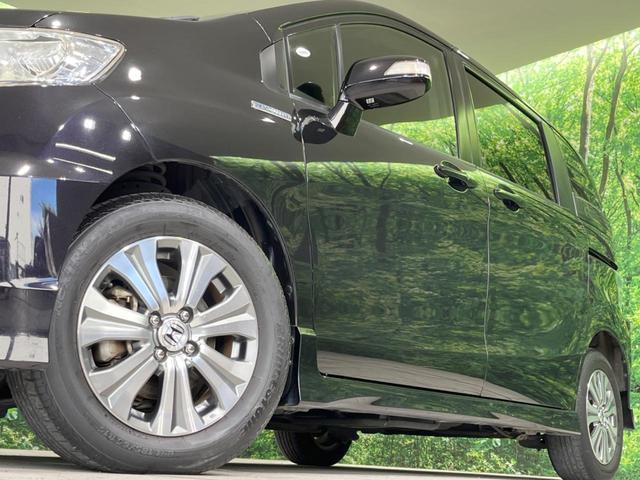 フリードスパイクハイブリッド ジャストセレクション SDナビ 両側電動スライドドア バックカメラ HIDヘッドランプ オートライト ETC Bluetooth フルセグTV クルーズコントロール スマートキー 純正16インチアルミ オートエアコン(12枚目)