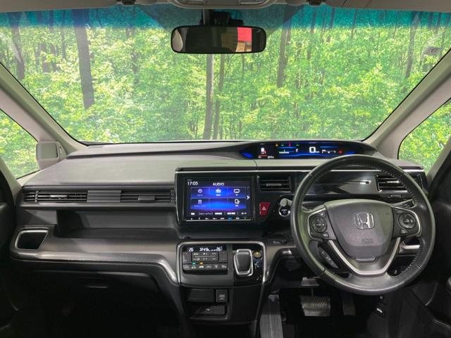 ステップワゴンスパーダ スパーダハイブリッド　Ｇ　ホンダセンシング　禁煙車　純正９型ナビ　両側電動ドア　後席モニター　衝突軽減装置　レーダークルーズ　バックカメラ　ＬＥＤヘッド＆フォグ　デュアルエアコン　純正１６インチアルミ　車線逸脱警報　ビルトインＥＴＣ（2枚目）