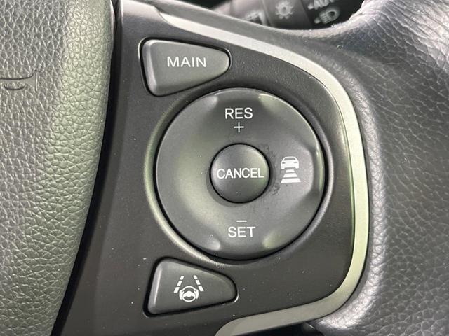 ステップワゴンスパーダ スパーダハイブリッド　Ｇ　ホンダセンシング　禁煙車　純正９型ナビ　両側電動ドア　後席モニター　衝突軽減装置　レーダークルーズ　バックカメラ　ＬＥＤヘッド＆フォグ　デュアルエアコン　純正１６インチアルミ　車線逸脱警報　ビルトインＥＴＣ（7枚目）