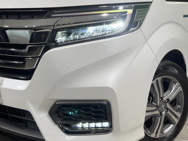 ステップワゴンスパーダ スパーダハイブリッド　Ｇ　ホンダセンシング　禁煙車　純正９型ナビ　両側電動ドア　後席モニター　衝突軽減装置　レーダークルーズ　バックカメラ　ＬＥＤヘッド＆フォグ　デュアルエアコン　純正１６インチアルミ　車線逸脱警報　ビルトインＥＴＣ（14枚目）