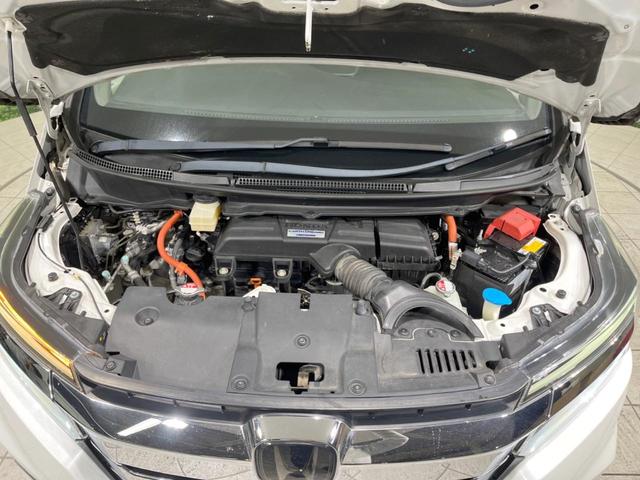 ステップワゴンスパーダ スパーダハイブリッド　Ｇ　ホンダセンシング　禁煙車　純正９型ナビ　両側電動ドア　後席モニター　衝突軽減装置　レーダークルーズ　バックカメラ　ＬＥＤヘッド＆フォグ　デュアルエアコン　純正１６インチアルミ　車線逸脱警報　ビルトインＥＴＣ（20枚目）