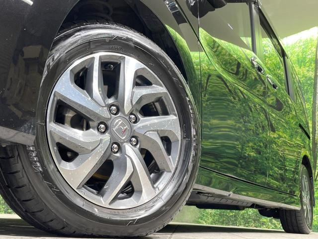 ステップワゴンスパーダ スパーダアドバンスパッケージβ　純正９型ナビ　両側電動ドア　後席モニター　衝突軽減装置　レーダークルーズ　禁煙車　スマートキー　ＬＥＤヘッド　ビルトインＥＴＣ　純正１６インチアルミ　車線逸脱警報　オートライト（12枚目）