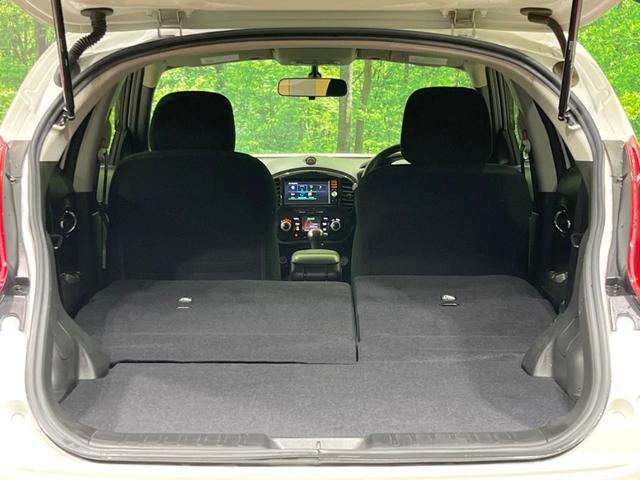 ジューク 15RX タイプV 禁煙車 純正ナビ バックカメラ HIDヘッドランプ ETC フルセグTV スマートキー 純正17インチアルミ オートライト オートエアコン 電動格納ミラー ドアバイザー CD再生(10枚目)