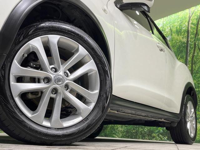 ジューク 15RX タイプV 禁煙車 純正ナビ バックカメラ HIDヘッドランプ ETC フルセグTV スマートキー 純正17インチアルミ オートライト オートエアコン 電動格納ミラー ドアバイザー CD再生(13枚目)