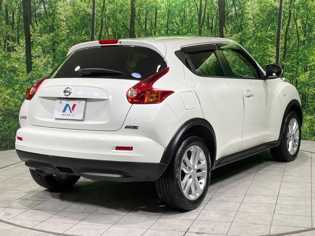 ジューク 15RX タイプV 禁煙車 純正ナビ バックカメラ HIDヘッドランプ ETC フルセグTV スマートキー 純正17インチアルミ オートライト オートエアコン 電動格納ミラー ドアバイザー CD再生(17枚目)