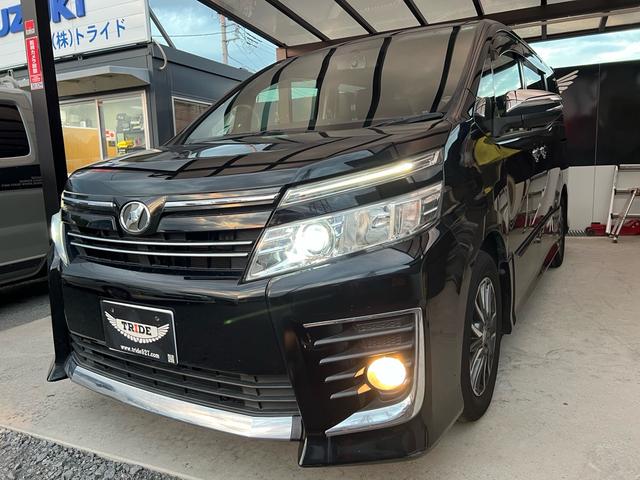 ヴォクシー ZS 煌 地上デジタル 両側パワードア アイドリングストップ車 パワーウィンド 横滑防止 ブルートゥースオーディオ Aライト 衝突安全ボディ 整備記録簿 DVD可 フルフラットシート 電格ミラー 盗難防止装置(2枚目)