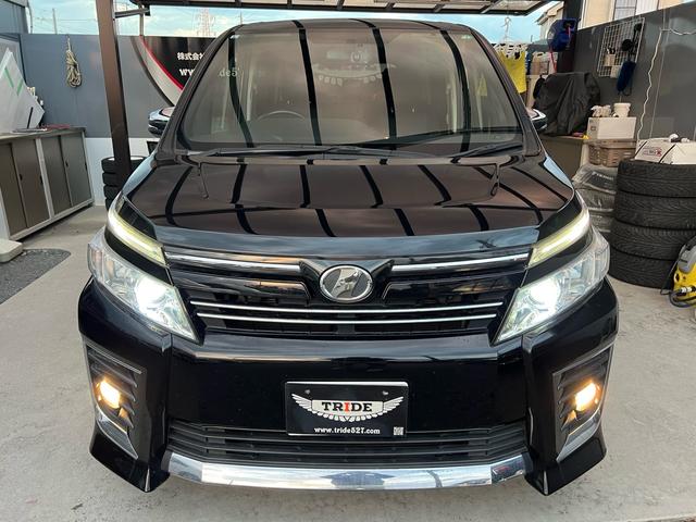 ヴォクシー ZS 煌 地上デジタル 両側パワードア アイドリングストップ車 パワーウィンド 横滑防止 ブルートゥースオーディオ Aライト 衝突安全ボディ 整備記録簿 DVD可 フルフラットシート 電格ミラー 盗難防止装置(23枚目)