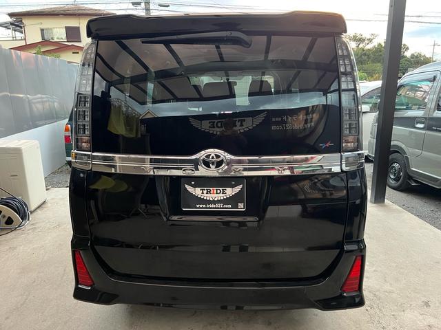 ヴォクシー ZS 煌 地上デジタル 両側パワードア アイドリングストップ車 パワーウィンド 横滑防止 ブルートゥースオーディオ Aライト 衝突安全ボディ 整備記録簿 DVD可 フルフラットシート 電格ミラー 盗難防止装置(28枚目)