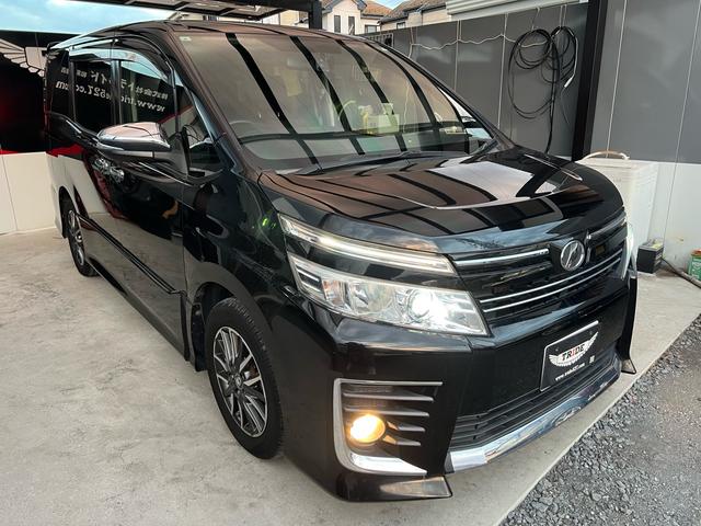 ヴォクシー ZS 煌 地上デジタル 両側パワードア アイドリングストップ車 パワーウィンド 横滑防止 ブルートゥースオーディオ Aライト 衝突安全ボディ 整備記録簿 DVD可 フルフラットシート 電格ミラー 盗難防止装置(33枚目)