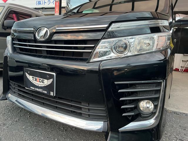 ヴォクシー ZS 煌 地上デジタル 両側パワードア アイドリングストップ車 パワーウィンド 横滑防止 ブルートゥースオーディオ Aライト 衝突安全ボディ 整備記録簿 DVD可 フルフラットシート 電格ミラー 盗難防止装置(36枚目)