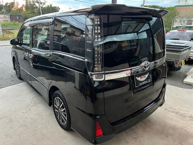 ヴォクシー ZS 煌 地上デジタル 両側パワードア アイドリングストップ車 パワーウィンド 横滑防止 ブルートゥースオーディオ Aライト 衝突安全ボディ 整備記録簿 DVD可 フルフラットシート 電格ミラー 盗難防止装置(39枚目)