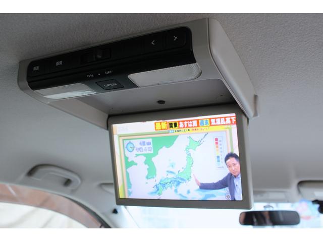 エルグランド ２５０ハイウェイスター　後席モニター　Ｂｌｕｅｔｏｏｔｈ　両側パワースライドドア　ＥＴＣ　セキュリティ　バックカメラ　オットマン　マルチファンクションコンソール　デイライト　ウォークスルー　サンシェード　ＴＶ（20枚目）
