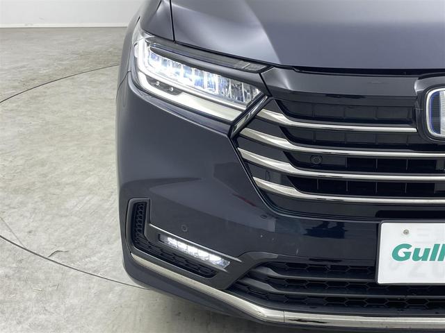 オデッセイハイブリッド ｅ：ＨＥＶアブソルート・ＥＸ　純正１０型ナビ　ＨＤＭＩ　全方位カメラ　純正後席モニター　ＡｐｐｌｅＣａｒＰｌａｙ　電動リアゲート　パーキングアシスト　ホンダセンシング　衝突軽減　レーダークルーズ　両側パワスラ　純正ドラレコ　ＥＴＣ（35枚目）