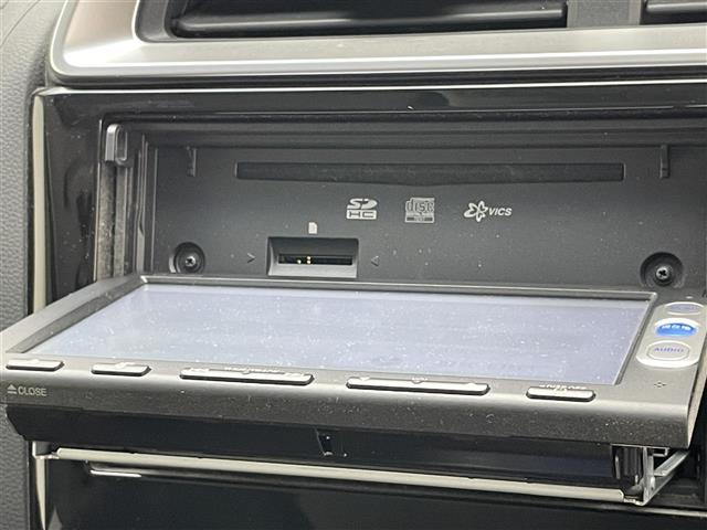 フィットハイブリッド Ｌパッケージ　純正ナビ　ＣＤ　ラジオ　Ｂｌｕｅｔｏｏｔｈ　バックカメラ　ハーフレザー　ＬＥＤオートライト　純正フロアマット　ＥＴＣ　クルーズコントロール　プッシュスタート　ステアリングスイッチ　ドアバイザー　禁煙車（9枚目）