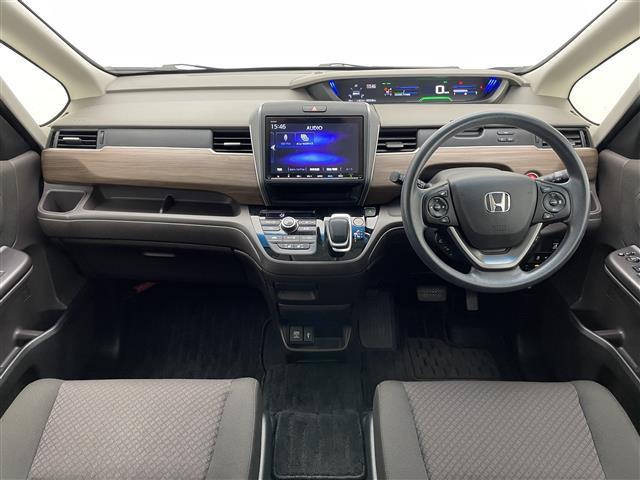 フリードハイブリッド ハイブリッド・Ｇホンダセンシング　純正９型ナビ　バックカメラ　両側パワスラ　禁煙　フルセグ　ＤＶＤ　追従クルコン　ホンダセンシング　ＥＴＣ　ドラレコ　シートヒーター　衝突軽減　車線逸脱　ＬＥＤオートライト　ＵＳＢ接続　コーナーセンサー（2枚目）