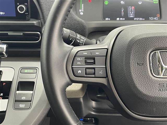 フリード ｅ：ＨＥＶエアー　ＥＸ　禁煙車／純正９型ナビ／両側パワースライドドア／全方位カメラ／追従クルーズコントロール／レーンキープアシスト／ハーフレザーシート／シートヒーター／ブラインドスポットインフォメーション／クリアランスソナー（12枚目）